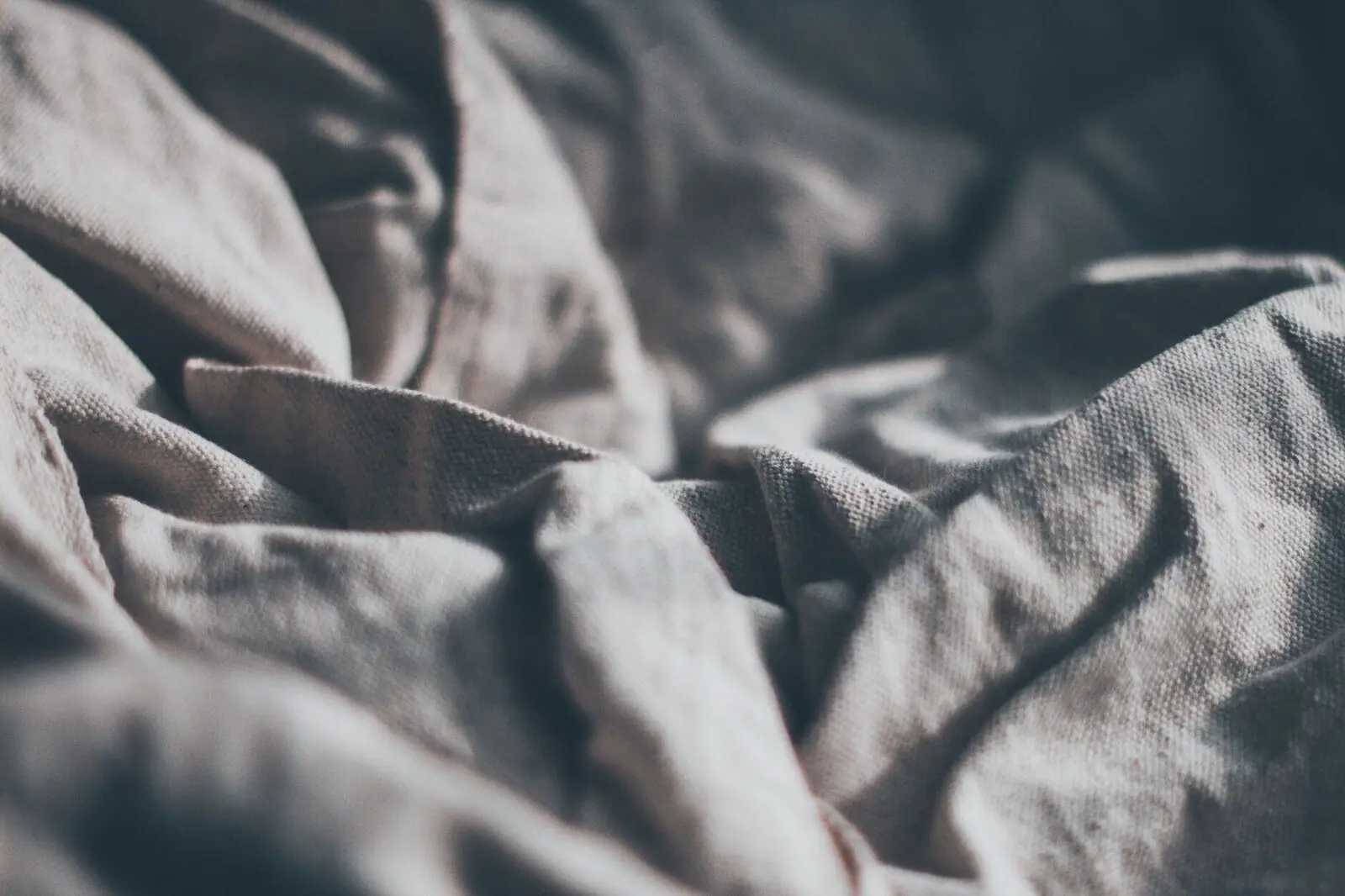 Linen sheets in morning light