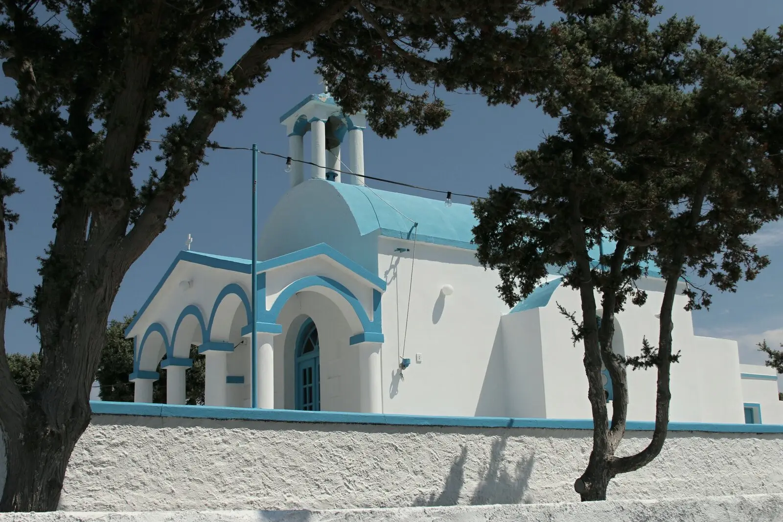 Agios Nikolaos at Pollonia, between the trees